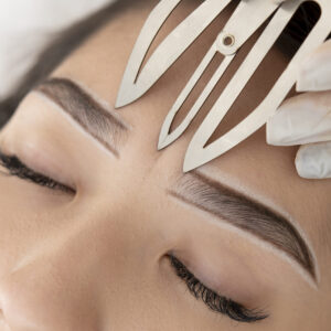 young-female-client-going-through-microblading-procedure